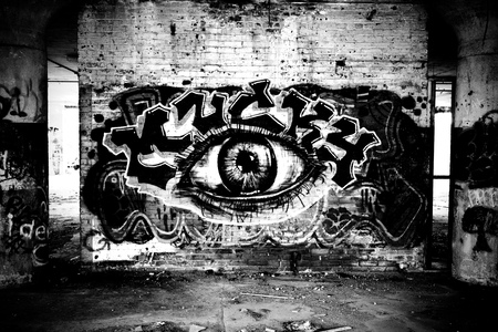 Graffiti of an eye on a brick wall by Mucky.