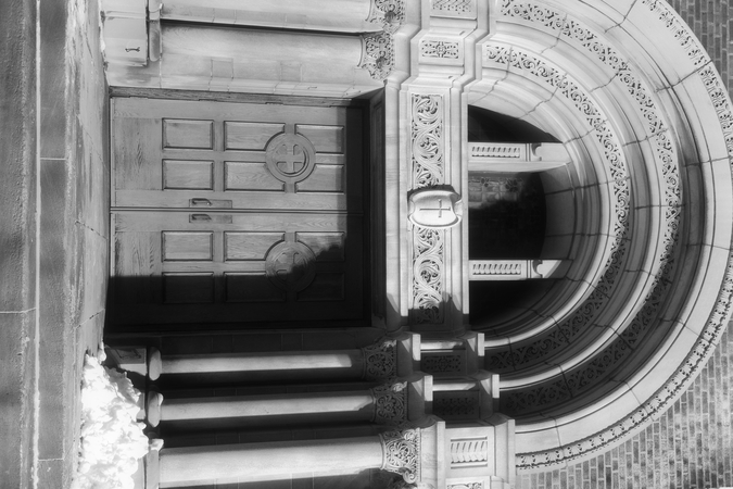 A church door in partial shadow.